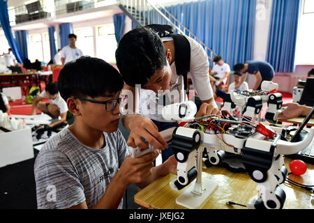 Rizhao, China's Shandong Province. 16th Aug, 2017. Contestants adjust robots at China robot competition in Rizhao City, east China's Shandong Province, Aug. 16, 2017. A total of 3,450 contestants from 210 universities participated in the contest. Credit: Lu Jie/Xinhua/Alamy Live News Stock Photo