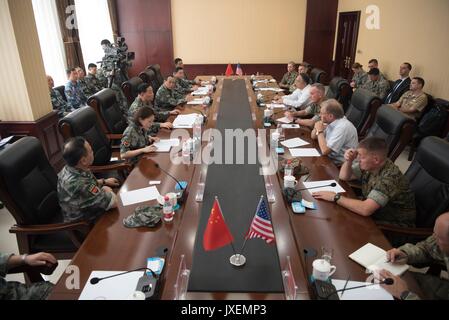 Shenyang, China. 16th Aug, 2017. U.S. Chairman of the Joint Chiefs Gen. Joseph Dunford, right, joins People's Liberation Army Gen. Song Puxuan, left, during roundtable discussions at Infantry Brigade Headquarters for the Chinese Northern Theater Command August 16, 2017 in Haichung, China. Dunford told Chinese leaders that the U.S. hoped diplomatic and economic pressure would convince North Korea to end its nuclear program, but that it was also preparing military options. Credit: Planetpix/Alamy Live News Stock Photo