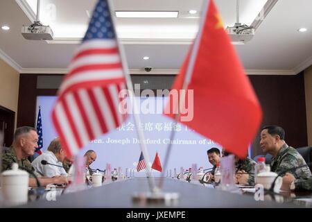 Shenyang, China. 16th Aug, 2017. U.S. Chairman of the Joint Chiefs Gen. Joseph Dunford, left, joins People's Liberation Army Gen. Song Puxuan, right, during roundtable discussions at Infantry Brigade Headquarters for the Chinese Northern Theater Command August 16, 2017 in Haichung, China. Dunford told Chinese leaders that the U.S. hoped diplomatic and economic pressure would convince North Korea to end its nuclear program, but that it was also preparing military options. Credit: Planetpix/Alamy Live News Stock Photo