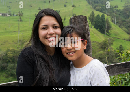 Good-looking single-parent mom and teen son on white background