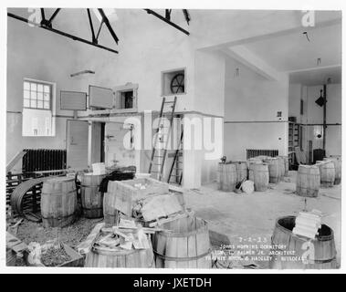 Alumni Memorial Residences Interior of AMR, most likely of kitchen, Kegs and construction materials fill the room, 1923. Stock Photo