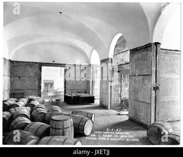 Alumni Memorial Residences Interior shot of AMR, most likely of basement or first floor, Room appears to be an arcade, Kegs are on the floor and radiatiors are set aside by a wall, 1923. Stock Photo