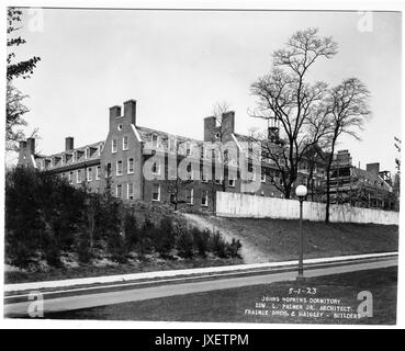 Alumni Memorial Residences AMR facing Charles Street, Construction fence still up, as is scaffolding around a smaller structure connected to the AMR, 1923. Stock Photo