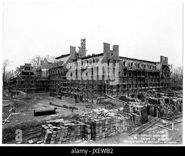 Alumni Memorial Residences Exterior shot of AMR, Scaffolding around the back of building, Stacks of construction material in the foreground, 1923. Stock Photo