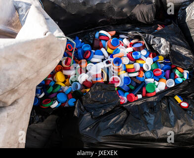 https://l450v.alamy.com/450v/jxexek/pile-of-plastic-bottle-caps-waiting-to-be-recycled-jxexek.jpg