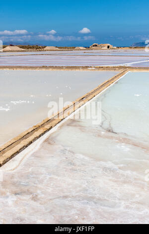 Saltpans with salt being produced by evaporation of seawater Culcasi, south of  Trapani, on the west coast of Sicily, Italy. Stock Photo