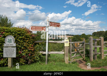 1066 Country Walk, finger post footpath signs pointing from Battle to Pevensey and from Battle to Rye, East Sussex countryside, UK, GB Stock Photo