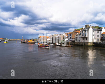 dh Whitby Harbour WHITBY NORTH YORKSHIRE Excusion boat returning to Whitby town houses abbey tourism trip Stock Photo