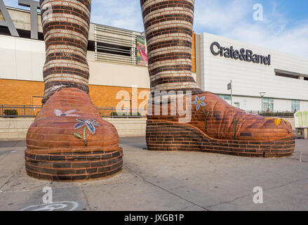 Giant ceramic leg and boot sculpture called 'Immense Mode' at Southgate Transit Centre, Edmonton, Alberta, Canada Stock Photo