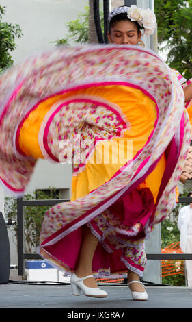 Female folk dancer in vibrant Mexican costume Stock Photo