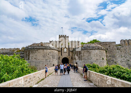 Rhodes, Greece - 17 April, 2017: Gate d’Amboise (Ambrose Gate) and bridge leading to it in Rhodes old town with tourists Stock Photo