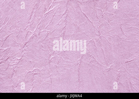 Light violet wavy background from a textile material. Fabric with fold texture closeup. Creased shiny lilac cloth. Stock Photo