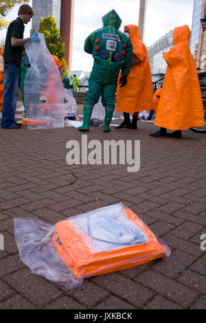 A pre-packed orange coverall thrown into the 'hot' or contaminated area to be used by students changing into the brightly coloured clothing after bein Stock Photo