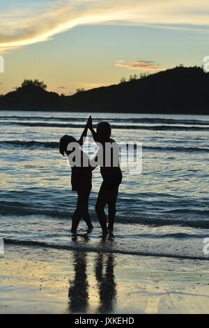 couple  dancing  on  tropical beach Stock Photo