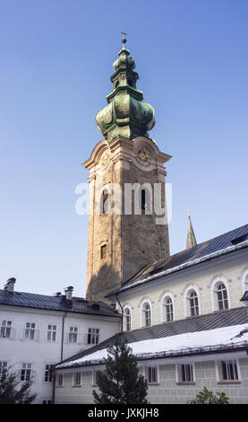 Cathedral tower viewed from St Peter's Cemetery Salzburg, Austria with snow in winter Stock Photo