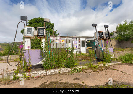 Disused Petrol fuel gas garage forecourt in rural Scotland Helmsdale UK Stock Photo