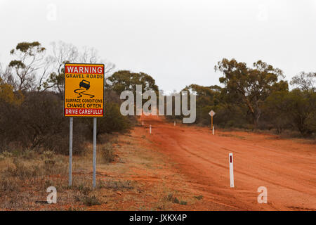 Australian Gravel Road  warning sign, Murchison, Western Australia Stock Photo