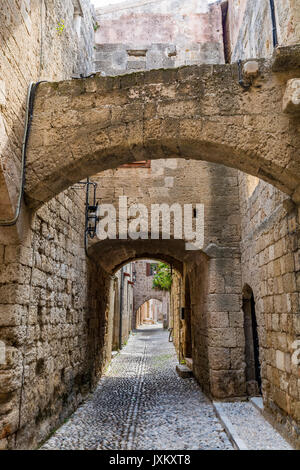 Charming narrow street in the old town of Rhodes, Rhodes island, Greece Stock Photo