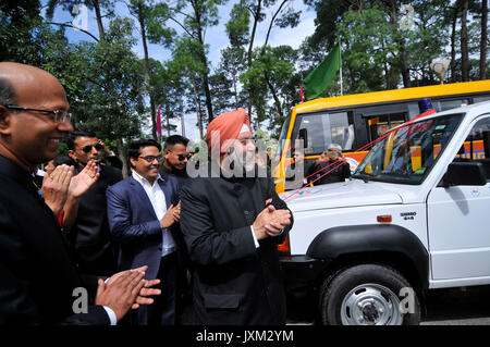 Indian Ambassador to Nepal Manjeev Singh Puri claps after cutting the ribbon to give 30 Ambulances & 6 buses to hospitals at the Embassy premises to during India's 71st Independence Day at Kathmandu, Nepal on Tuesday, August 15, 2017. (Photo by Narayan Maharjan/Pacific Press) Stock Photo