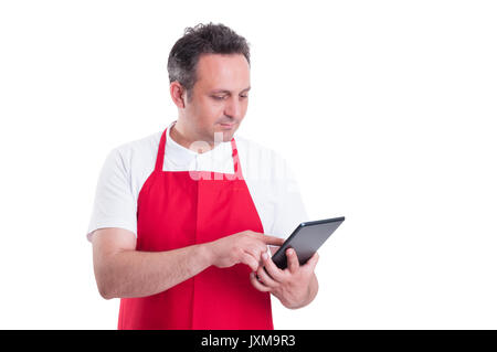 Young store supervisor with tablet pc in hand checking the product stock Stock Photo