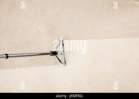 Close-up Photo Of Vacuum Cleaner With Carpet Stock Photo