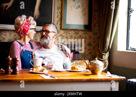 Quirky couple relaxing in bar and restaurant, Bournemouth, England Stock Photo