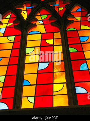 A view of one window of a triptych of modern stained glass by John McLean in the North Aisle of Norwich Cathedral, Norfolk, England, United Kingdom. Stock Photo