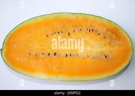 Half of watermelon with orange flesh isolated on white background Stock Photo
