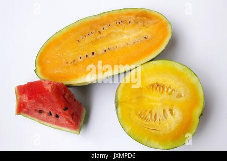 Watermelons with red, orange and yellow flesh isolated on white background Stock Photo