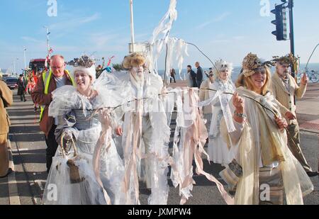 Costumed people take part in the parade along the seafront during the annual Frost Fair event at St. Leonards-on-Sea, England on November 29, 2014. Stock Photo