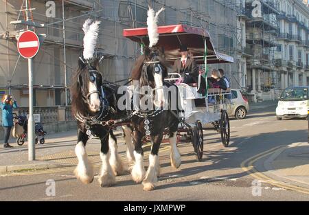 A horse drawn carriage gives rides in Warrior Square during the annual Frost Fair at St.Leonards-on-Sea in East Sussex, England on November 29, 2014. Stock Photo