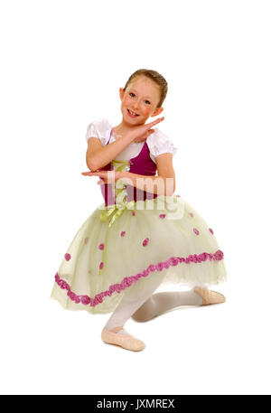 A smiling young ballerina girl in a pose Stock Photo