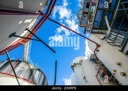 Low angle view of storage tanks and industrial piping at biofuel plant Stock Photo