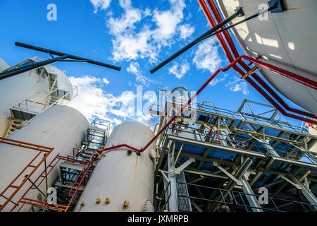 Low angle view of storage tanks and industrial piping at biofuel plant Stock Photo