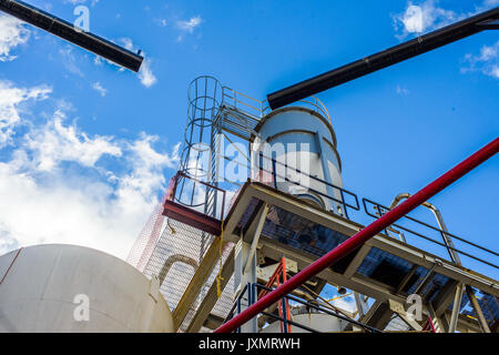 Low angle view of storage tanks and pipes at biofuel industrial plant Stock Photo