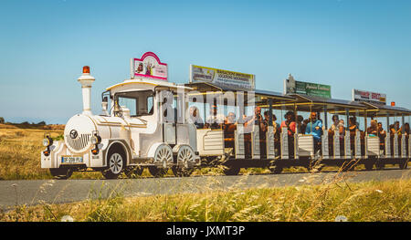 NOIRMOUTIER, FRANCE - July 03, 2017 : tourists visit the island of Noirmoutier, france, in a little tourist train Stock Photo