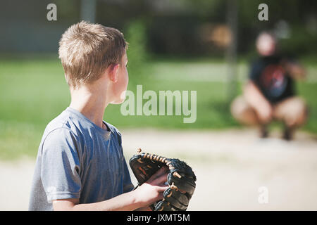 Father and son playing baseball Stock Photo