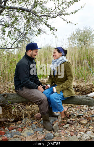 Romantic young couple gazing at each other at beach Stock Photo