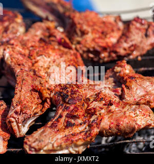 Roasted meat on the grill. Stock Photo