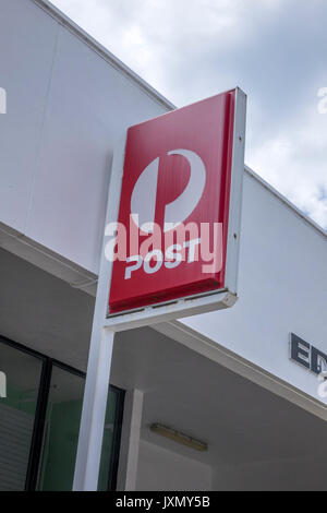 The Sign Logo Of Australia Post Outside A Post Office In Eden New South Wales Australia Stock Photo