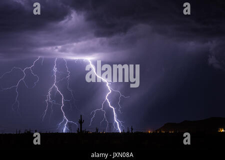 Strong thunderstorm with lightning bolts in the desert near Carefree, Arizona