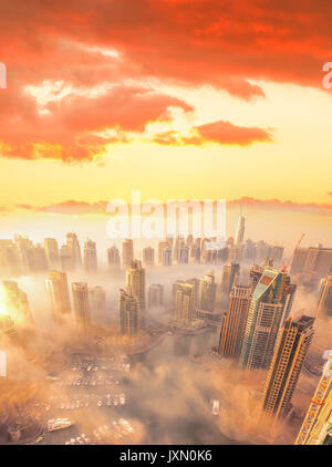 Dubai Marina covered by early morning fog in Dubai, United Arab Emirates Stock Photo