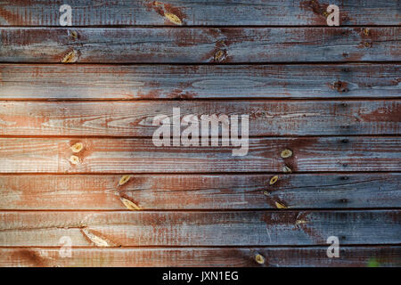 Brown scratched wooden board with light at left corner. Stock Photo