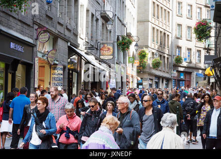 St Malo, Brittany France - crowds of people on a busy street in the Old Town ( Walled Town ), St Malo Brittany France Stock Photo