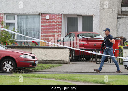 EDITORS NOTE IMAGE PIXELATED BY PA PICTURE DESK Gardai at the scene where man and a woman have been shot dead on Balbutcher Drive in Ballymun, Dublin. Stock Photo