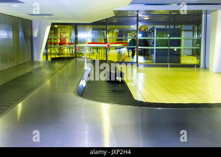 Airport carousel with a suitcase Stock Photo