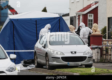 EDITORS NOTE IMAGE PIXELATED BY PA PICTURE DESK Forensics at the scene where man and a woman have been shot dead on Balbutcher Drive in Ballymun, Dublin. Stock Photo