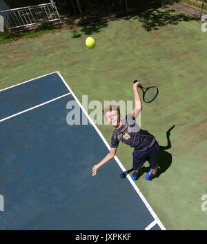 The left handed tennis serve Stock Photo