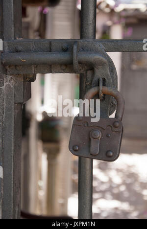 Security Device - Fence Secured With A Vintage Padlock Stock Photo