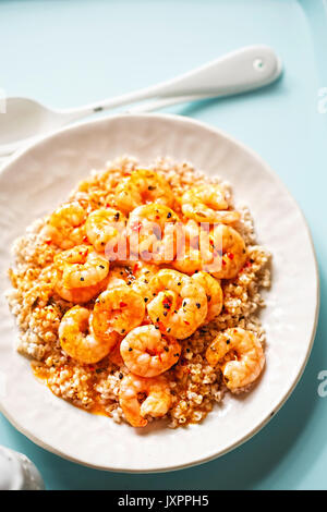 Prawns in sweet chilli sauce with barley Stock Photo